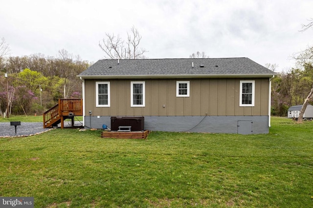 147 Fishermans Ln, Luray, VA 22835 - back of property with a hot tub, a deck, a lawn, and stairs