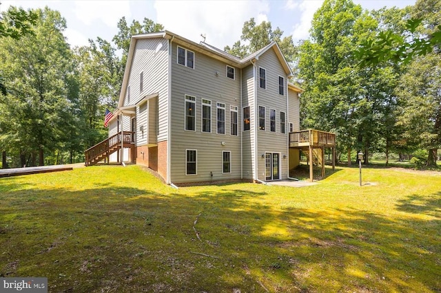 9937 Talley Rd, Spotsylvania, VA 22553 - rear view of property featuring stairs, a deck, and a lawn