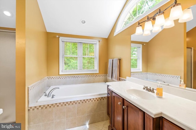 9937 Talley Rd, Spotsylvania, VA 22553 - full bathroom with lofted ceiling, vanity, a garden tub, tile patterned flooring, and recessed lighting