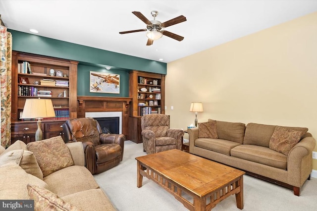9937 Talley Rd, Spotsylvania, VA 22553 - living area with light carpet, a ceiling fan, and a fireplace