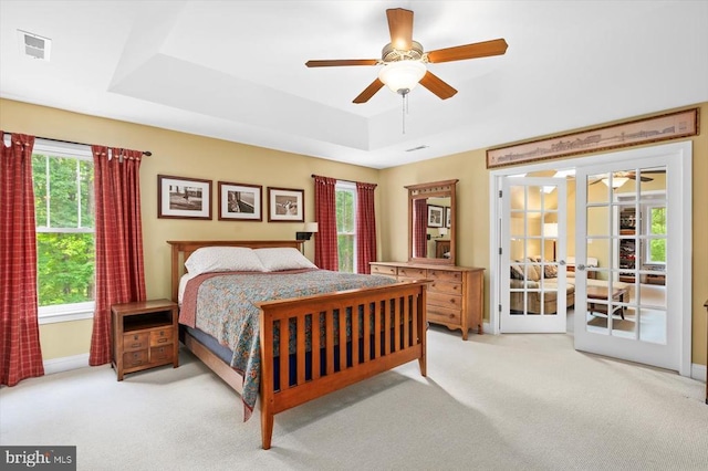 9937 Talley Rd, Spotsylvania, VA 22553 - carpeted bedroom featuring a tray ceiling, a ceiling fan, and access to exterior