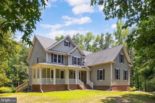 9937 Talley Rd, Spotsylvania, VA 22553 - view of front of property featuring covered porch, a front lawn, roof with shingles, and stairs