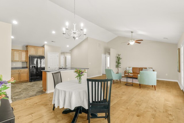 21 Upland Ct, Stuarts Draft, VA 24477 - dining area featuring lofted ceiling, light wood-type flooring, a ceiling fan, a chandelier, and recessed lighting