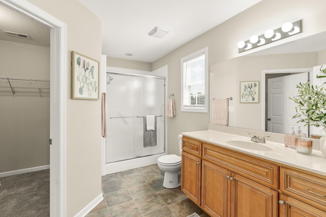 21 Upland Ct, Stuarts Draft, VA 24477 - bathroom with a stall shower, vanity, a walk in closet, and stone finish flooring