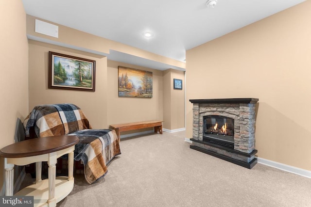  - sitting room with carpet, a stone fireplace, and recessed lighting