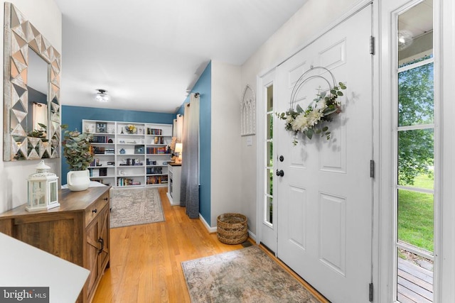  - entryway with light wood-style flooring