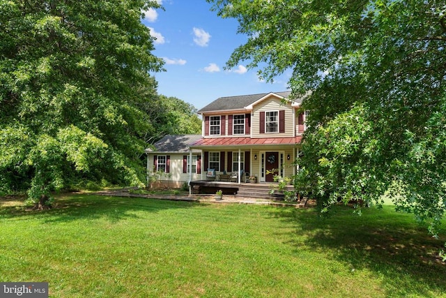  - view of front of property featuring covered porch and a front lawn