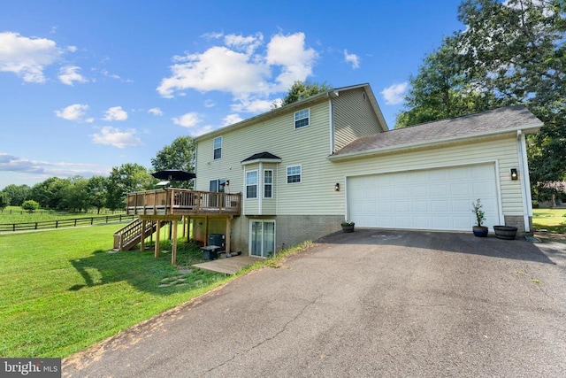  - view of front of house featuring a deck, stairway, driveway, and an attached garage