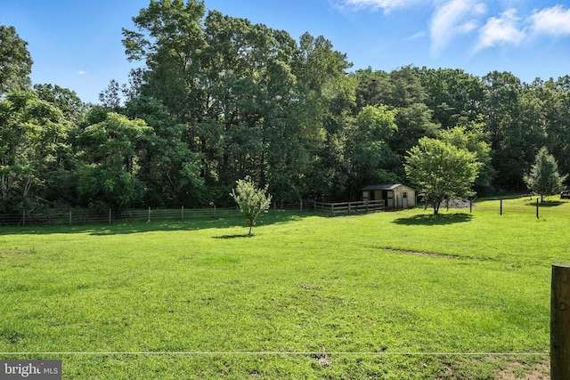  - view of yard with a shed and a view of rural / pastoral area