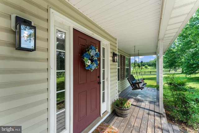  - entrance to property featuring a porch