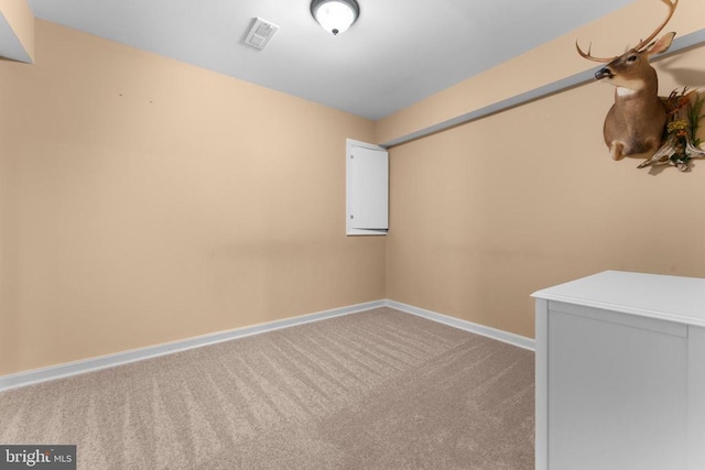  - carpeted empty room featuring baseboards