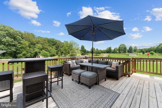  - wooden terrace with an outdoor living space and a lawn