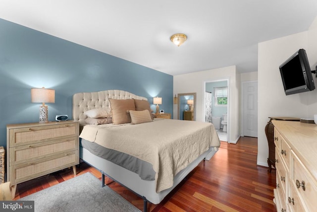  - bedroom with dark wood-style floors and ensuite bathroom