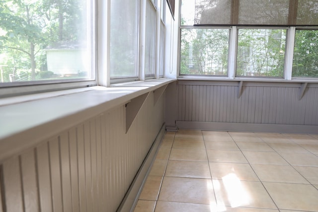 844 Lyndhurst Rd, Waynesboro, VA 22980 - unfurnished sunroom with plenty of natural light, tile patterned flooring, and wood walls