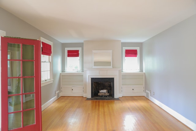 844 Lyndhurst Rd, Waynesboro, VA 22980 - unfurnished living room featuring a fireplace with flush hearth and wood finished floors