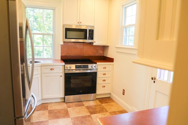 844 Lyndhurst Rd, Waynesboro, VA 22980 - kitchen featuring stainless steel appliances, plenty of natural light, and white cabinetry