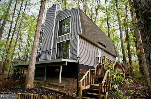 107 Birchside Cir, Locust Grove, VA 22508 - rear view of house featuring a wooden deck, a chimney, and stairs