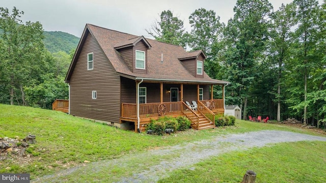 159 Park View Ln, Shenandoah, VA 22849 - view of front facade with covered porch, a storage shed, and a front lawn
