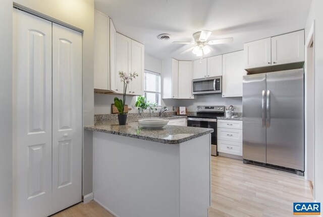 943 Southampton Dr, Charlottesville, VA 22901 - kitchen featuring stainless steel dishwasher, range, a peninsula, and healthy amount of natural light