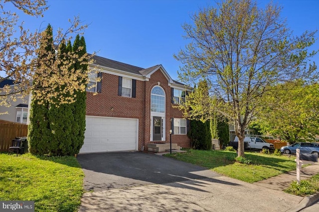 1745 Finley Dr, Culpeper, VA 22701 - view of front facade with brick siding, asphalt driveway, and a garage