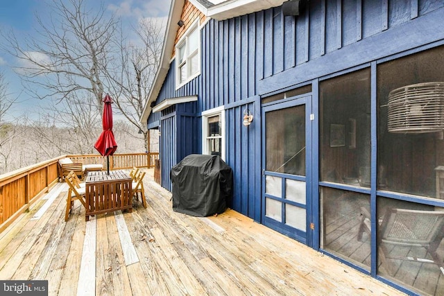 wooden terrace featuring grilling area