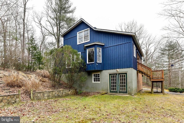 rear view of house with a yard