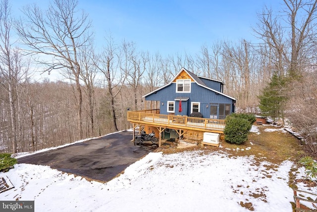 view of front of home featuring a wooden deck