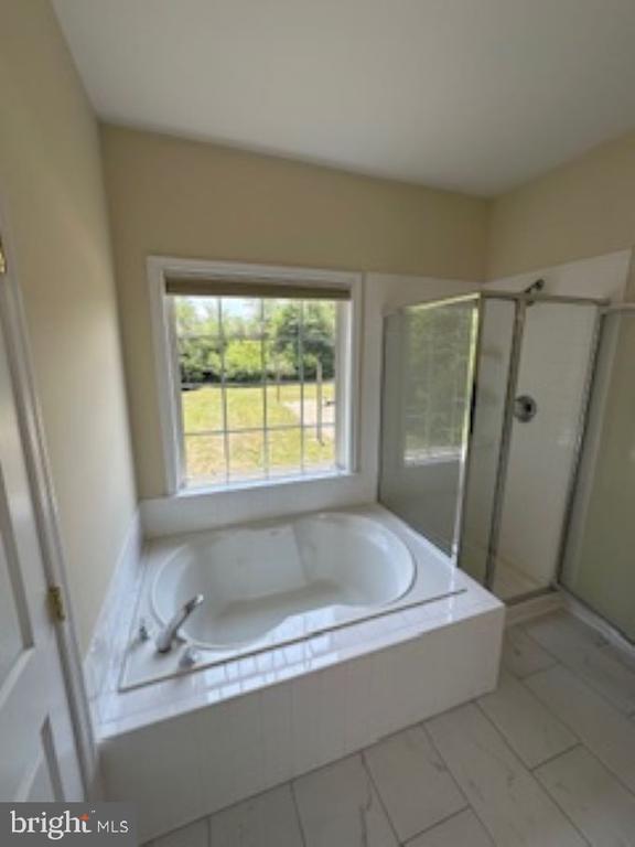 bathroom with plus walk in shower