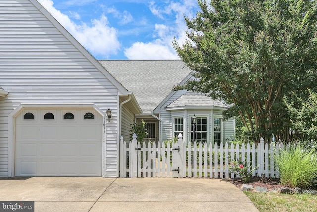 11611 Hampshire Ct, Fredericksburg, VA 22407 - view of front of property with driveway, roof with shingles, and a garage
