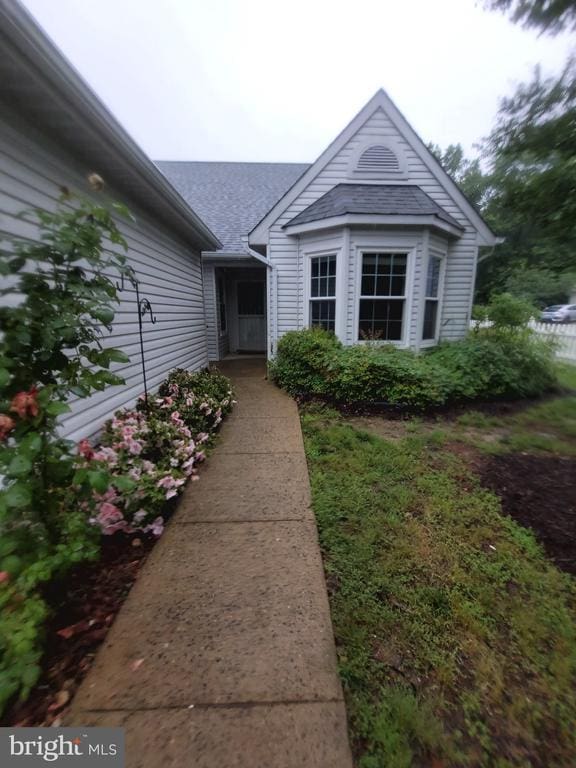 11611 Hampshire Ct, Fredericksburg, VA 22407 - view of exterior entry featuring a shingled roof