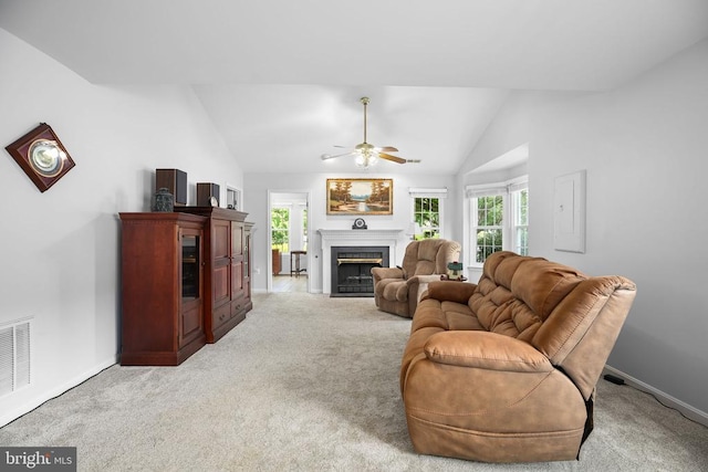 11611 Hampshire Ct, Fredericksburg, VA 22407 - living area with a ceiling fan, a fireplace with flush hearth, vaulted ceiling, light carpet, and healthy amount of natural light