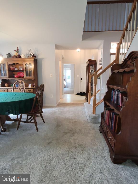 11611 Hampshire Ct, Fredericksburg, VA 22407 - dining room featuring stairs, carpet flooring, and baseboards