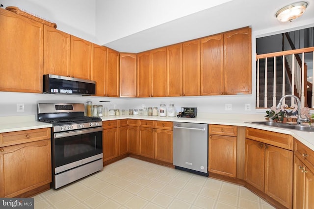 11611 Hampshire Ct, Fredericksburg, VA 22407 - kitchen featuring appliances with stainless steel finishes, light countertops, and brown cabinets