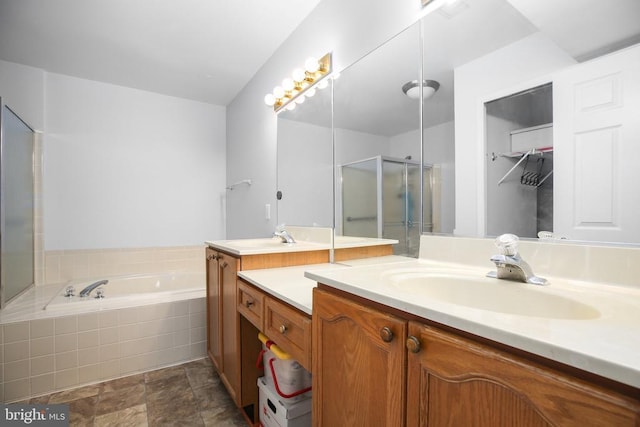 11611 Hampshire Ct, Fredericksburg, VA 22407 - bathroom with vanity, a garden tub, a stall shower, and stone finish floors
