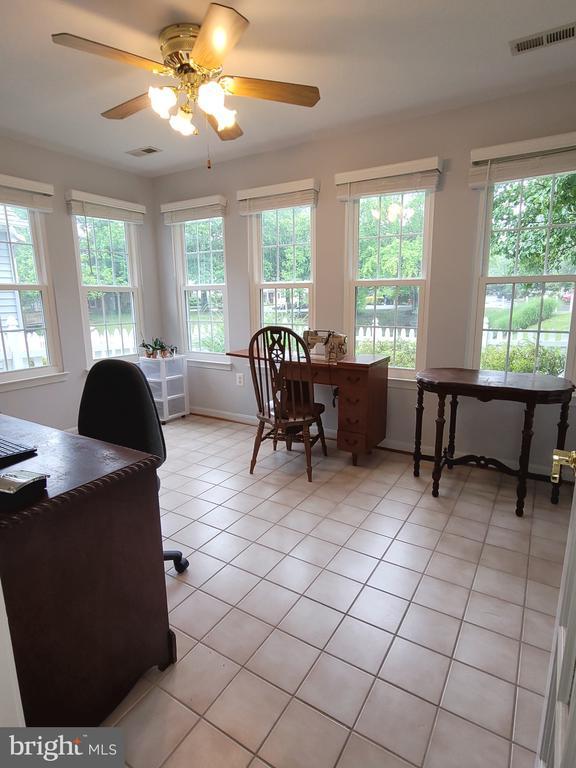 11611 Hampshire Ct, Fredericksburg, VA 22407 - office with light tile patterned flooring, plenty of natural light, baseboards, and a ceiling fan