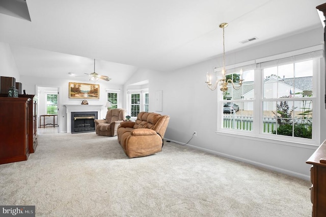 11611 Hampshire Ct, Fredericksburg, VA 22407 - living room featuring carpet flooring, lofted ceiling, a fireplace, a ceiling fan, and a chandelier