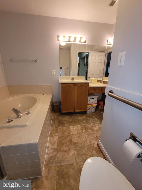 11611 Hampshire Ct, Fredericksburg, VA 22407 - bathroom with a bath and vanity