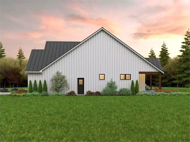 141 Birdsong Ln, Buena Vista, VA 24416 - property exterior at dusk featuring board and batten siding, a yard, metal roof, and a standing seam roof