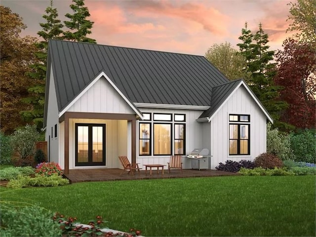 141 Birdsong Ln, Buena Vista, VA 24416 - back of house featuring a lawn, board and batten siding, a standing seam roof, and metal roof