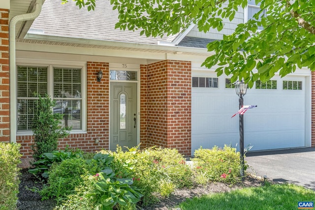 75 Cottage Ct, Zion Crossroads, VA 22942 - view of exterior entry featuring brick siding, driveway, and a garage