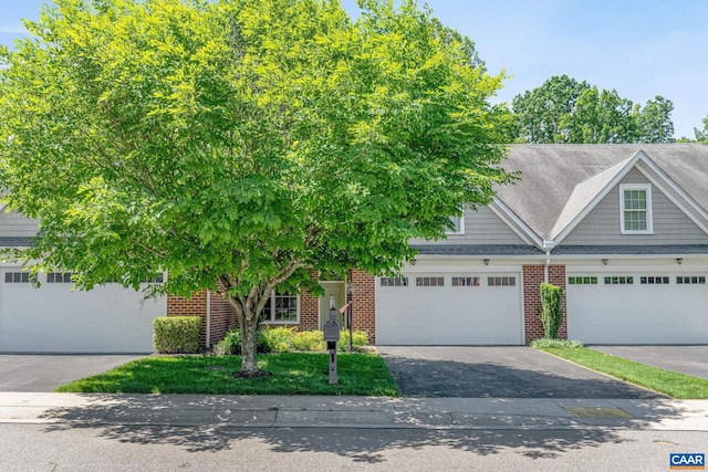 75 Cottage Ct, Zion Crossroads, VA 22942 - view of front facade featuring brick siding, asphalt driveway, a garage, and a shingled roof