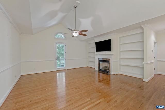 75 Cottage Ct, Zion Crossroads, VA 22942 - unfurnished living room featuring ceiling fan, a fireplace, light wood finished floors, built in shelves, and lofted ceiling