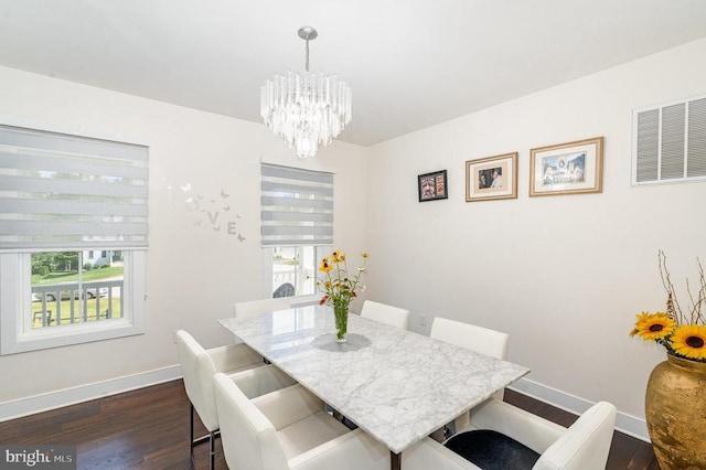 8806 Commons Cir, Spotsylvania, VA 22553 - dining area with a chandelier and dark wood finished floors