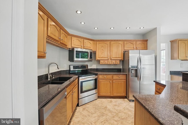 538 Colony Ct, Warrenton, VA 20186 - kitchen featuring stainless steel appliances, a sink, dark stone countertops, and recessed lighting