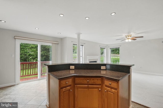 538 Colony Ct, Warrenton, VA 20186 - kitchen with plenty of natural light, a fireplace, a ceiling fan, a kitchen island, and recessed lighting