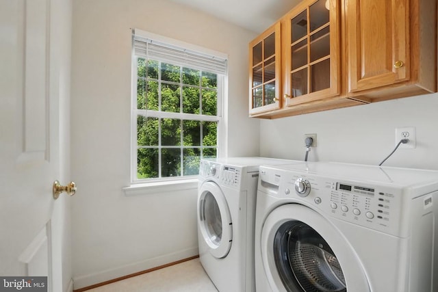 538 Colony Ct, Warrenton, VA 20186 - washroom with cabinet space, washer and dryer, healthy amount of natural light, and baseboards