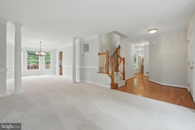538 Colony Ct, Warrenton, VA 20186 - carpeted empty room with a chandelier, decorative columns, stairs, baseboards, and crown molding
