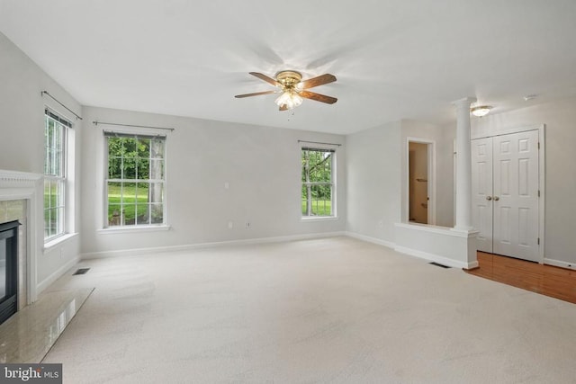 538 Colony Ct, Warrenton, VA 20186 - unfurnished living room featuring plenty of natural light, a ceiling fan, a fireplace, and baseboards