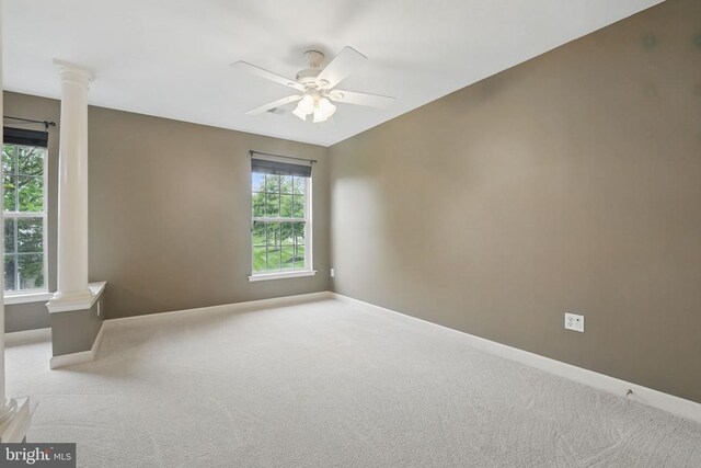 538 Colony Ct, Warrenton, VA 20186 - carpeted empty room featuring ornate columns, baseboards, and ceiling fan