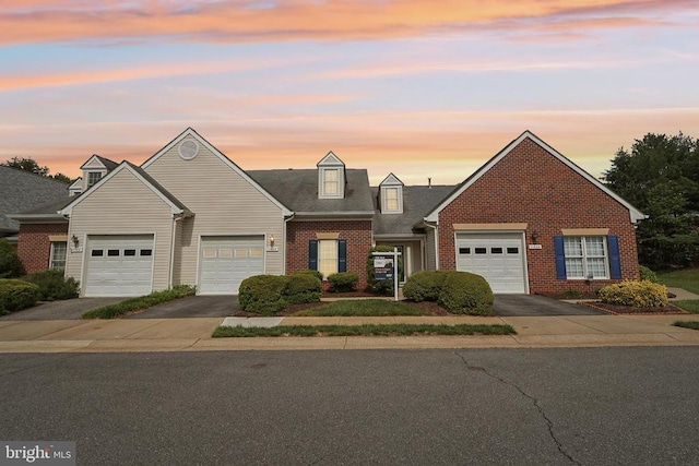 traditional-style home with brick siding and driveway